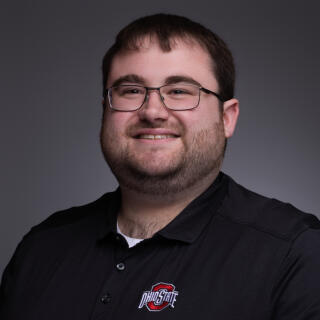 A headshot of Max Rosenberg