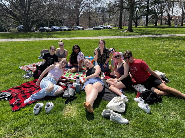 Students enjoying some downtime and sunshine in the yards surrounding the ASH houses.