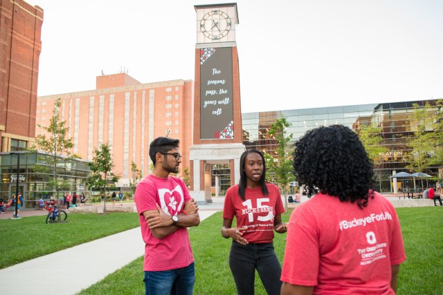 Students standing in the North District near the Davis Tower
