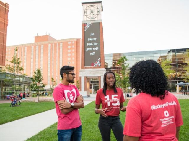 Students standing in the North District near the Davis Tower