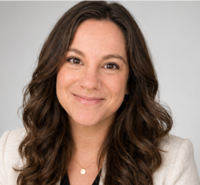 A headshot of Residential Scholarship Housing Specialist Jenn Schoolcraft