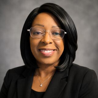 A headshot of Traci Woodard