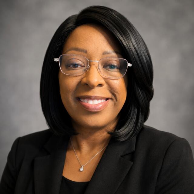 A headshot of Traci Woodard